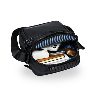 Black crossbody bag with striped interior, holding phone, wallet, and books — ideal for students and travel.