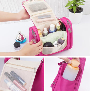 Pink travel toiletry bag with mesh pockets, holding cosmetics and travel essentials for organized packing
