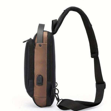 Side view of a brown and black sling laptop bag with adjustable strap and USB charging port
