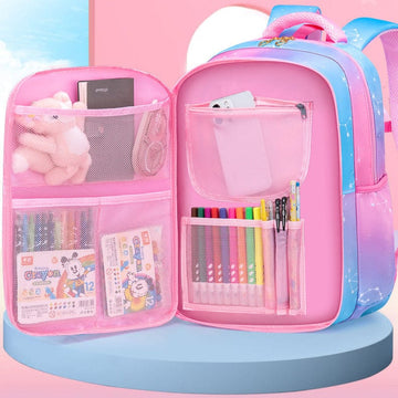 Pink and blue student backpack with organized mesh pockets holding crayons, pens, and school supplies