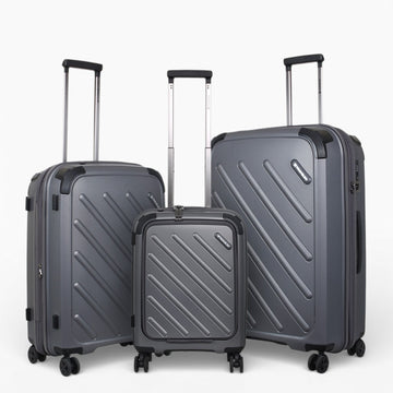 Grey hardshell travel luggage set with spinner wheels and extendable handles for easy mobility