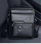 Black leather crossbody shoulder bag with front zipper pocket and adjustable strap on car seat