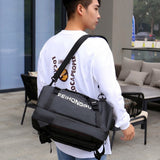 Black FEIHONGGU duffel bag with shoulder strap, ideal for travel and gym use