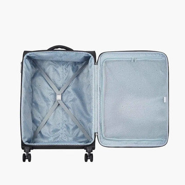 An open hard-shell suitcase shown from above, revealing a light blue-gray interior with a mesh door panel, zip pocket, and X-shaped compression strap, on a plain light gray background.