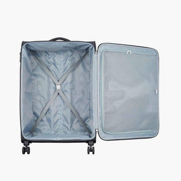 An open hard-shell suitcase shown from above on a light gray background, revealing a light blue-gray interior with a zippered compartment, mesh pocket, and gray compression straps.