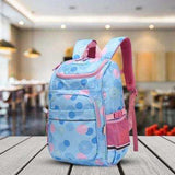 Blue polka dot kids backpack with pink straps, ideal for school or travel