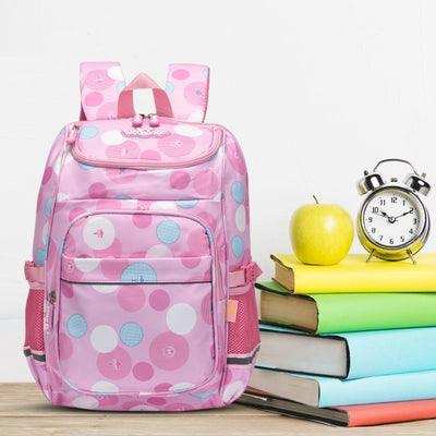 Pink polka dot student backpack with books, apple, and alarm clock for school