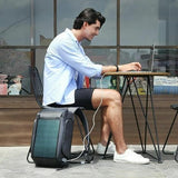 Solar-powered laptop backpack charging device at outdoor café, ideal for travel & students