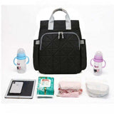 Black quilted diaper bag with baby bottles, diapers, wipes, and tablet — ideal for travel and daily use