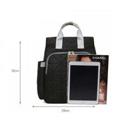 Black quilted backpack with silver handles, 36cm height, fits tablet & magazine, ideal for travel or school