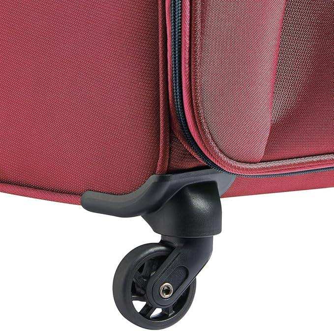 Red travel luggage with durable spinner wheel for smooth mobility
