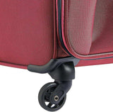Red travel luggage with durable spinner wheel for smooth mobility