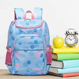 Blue polka dot student backpack with pink accents, ideal for school, books, and daily use