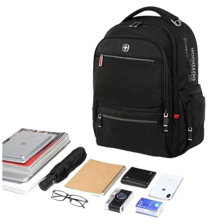 Black laptop backpack with multiple pockets, surrounded by gadgets, books, and accessories