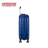 Blue American Tourister hardshell suitcase with 4 wheels and extendable handle for travel
