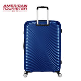 Blue American Tourister hardshell suitcase with 4 spinner wheels and telescopic handle, ideal for travel