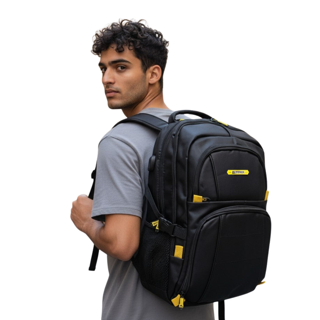 Man wearing a black backpack with yellow accents on a white background
