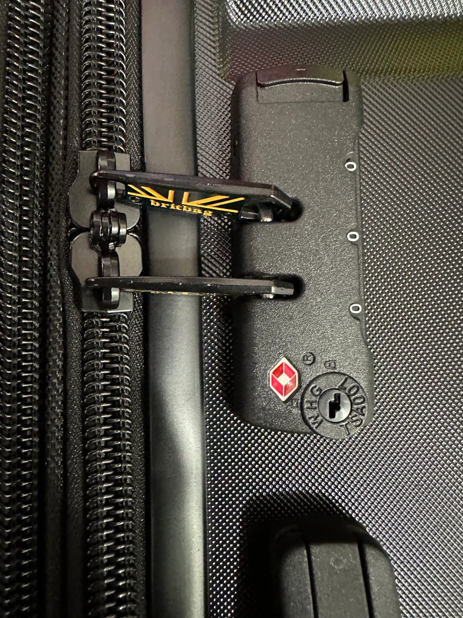 Briggs & Riley travel luggage zipper and lock detail, durable fabric with secure closure