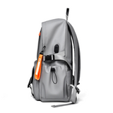 Gray travel backpack with orange tag, ideal for students and laptop carry, featuring adjustable straps and side pockets.