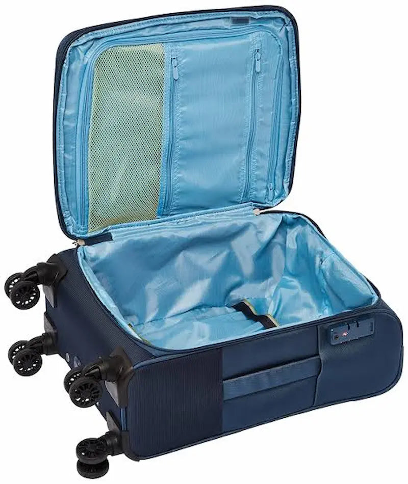 An open navy blue hard-shell suitcase with a light blue interior, showing multiple compartments, a mesh pocket on the inside lid, and four spinner wheels.