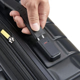 Hand using Delsey luggage scale on black travel suitcase with zipper detail