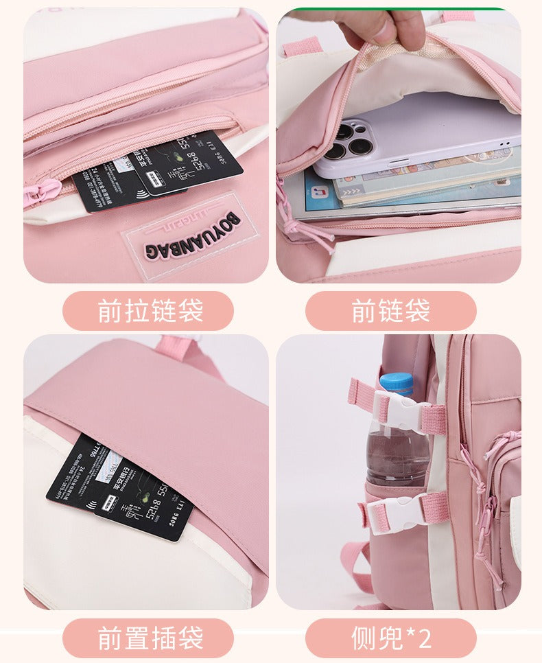Pink student backpack with front zip pocket, side water bottle holders, and card slots for school or travel use