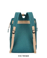 Teal school backpack with beige adjustable shoulder straps, rear view