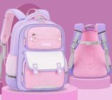 Pink and purple school backpacks with multiple compartments on a pink display pedestal