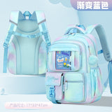 Pastel rainbow student backpack with front pocket, pom-pom charm, and ergonomic straps for school or travel