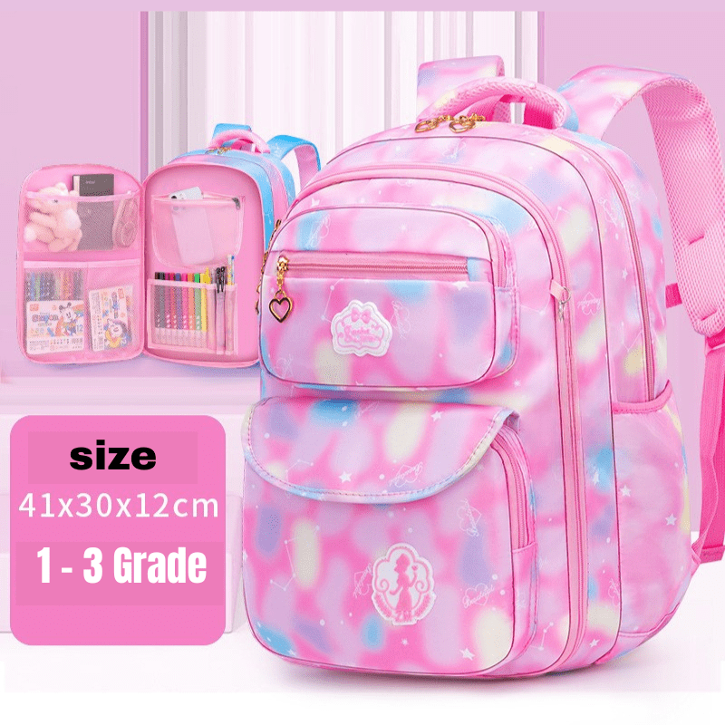 Pink tie-dye school backpack for grades 1-3 with multiple pockets, heart zipper pull, and unicorn design