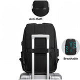 Black anti-theft travel backpack with breathable back panel, shown attached to suitcase handle