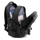 Spacious black laptop backpack with multiple zippered compartments, filled with books and folders