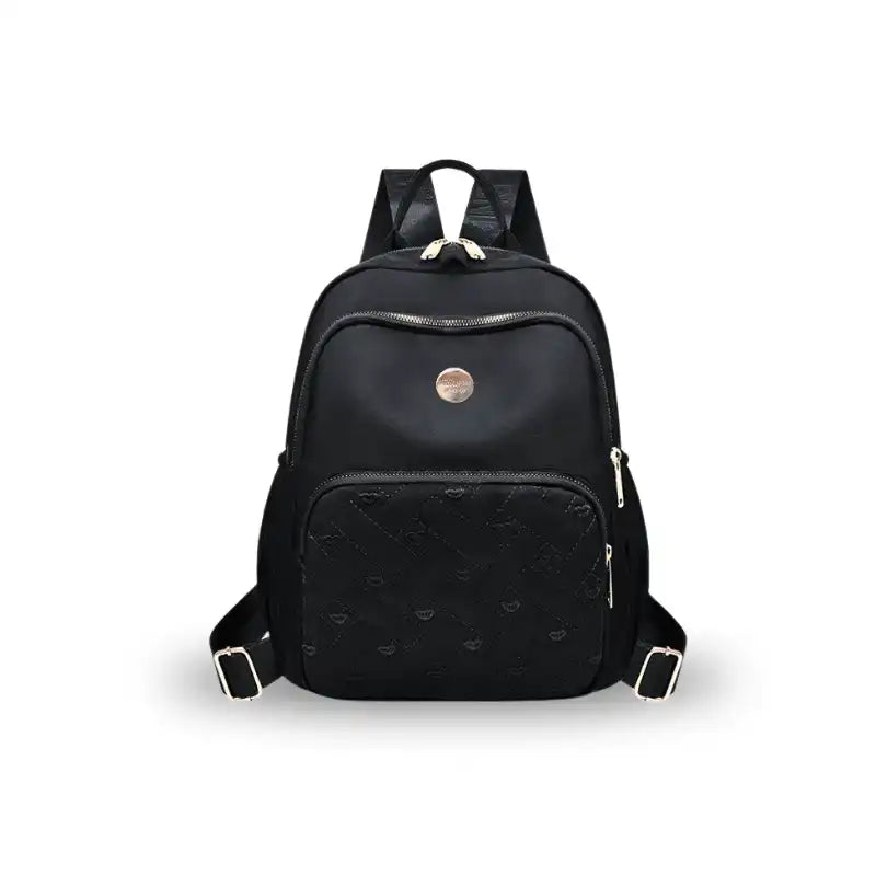 Black quilted travel backpack with gold zippers and logo, ideal for students and laptop carry