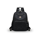 Black quilted travel backpack with gold zippers and logo, ideal for students and laptop carry