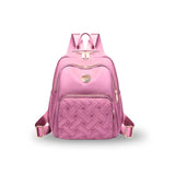 Pink quilted backpack with gold zippers, ideal for travel or school