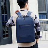 Navy blue laptop backpack for students and travel, featuring multiple pockets and comfortable straps