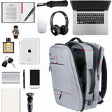 Grey laptop backpack with multiple compartments, ideal for travel, school, or work with tech gear and essentials