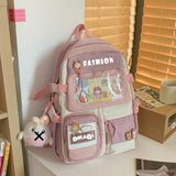 Pink and cream student backpack with cute cartoon patches, ideal for school or travel
