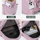 Pink laptop backpack with side pockets, rear zippered compartment, and spacious interior for travel or school