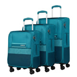 Three-piece American Tourister spinner luggage set in teal blue, featuring a softside carry-on, a medium suitcase, and a hardside suitcase, shown on a white background.