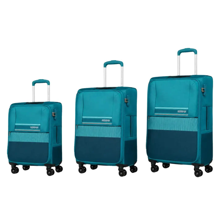 Three matching hard-shell spinner suitcases in teal and navy blue, arranged by size from left to right on a plain white background. The suitcases have telescoping handles extended and visible zipper pulls and brand name details.