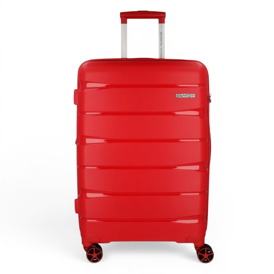 Red American Tourister hardshell suitcase with 4 spinner wheels, ideal for travel luggage
