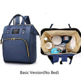 Navy blue multipurpose backpack with front pocket, spacious main compartment and organized baby items inside.