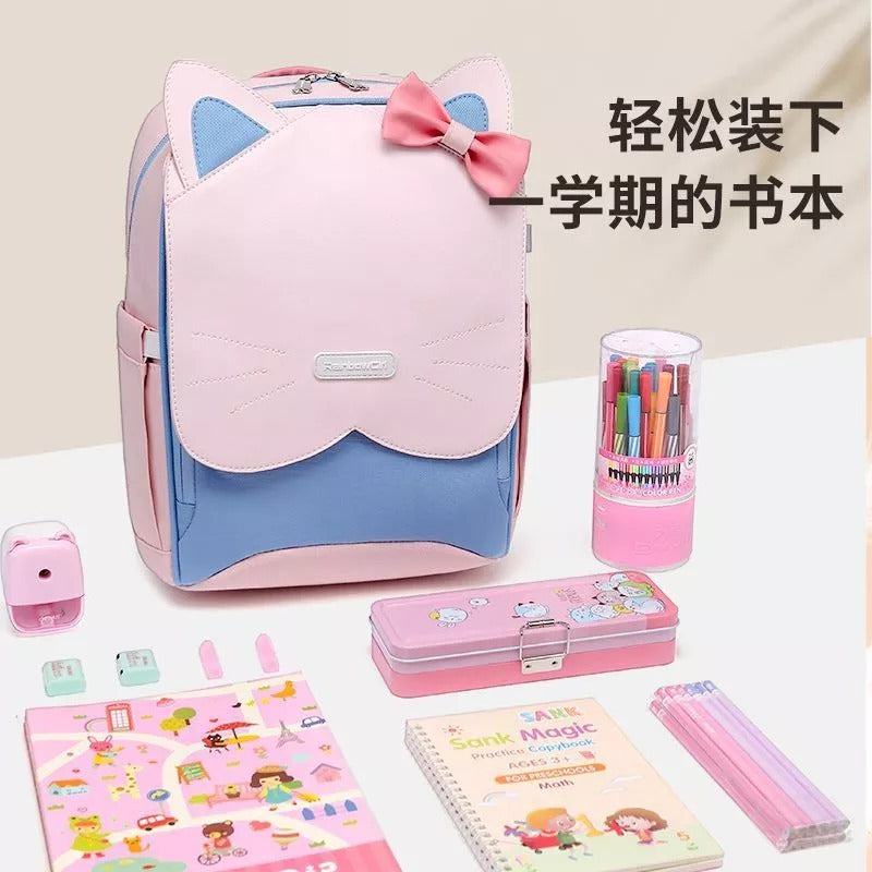 Pink cat-ear school backpack with bow, perfect for students and travel, paired with stationery