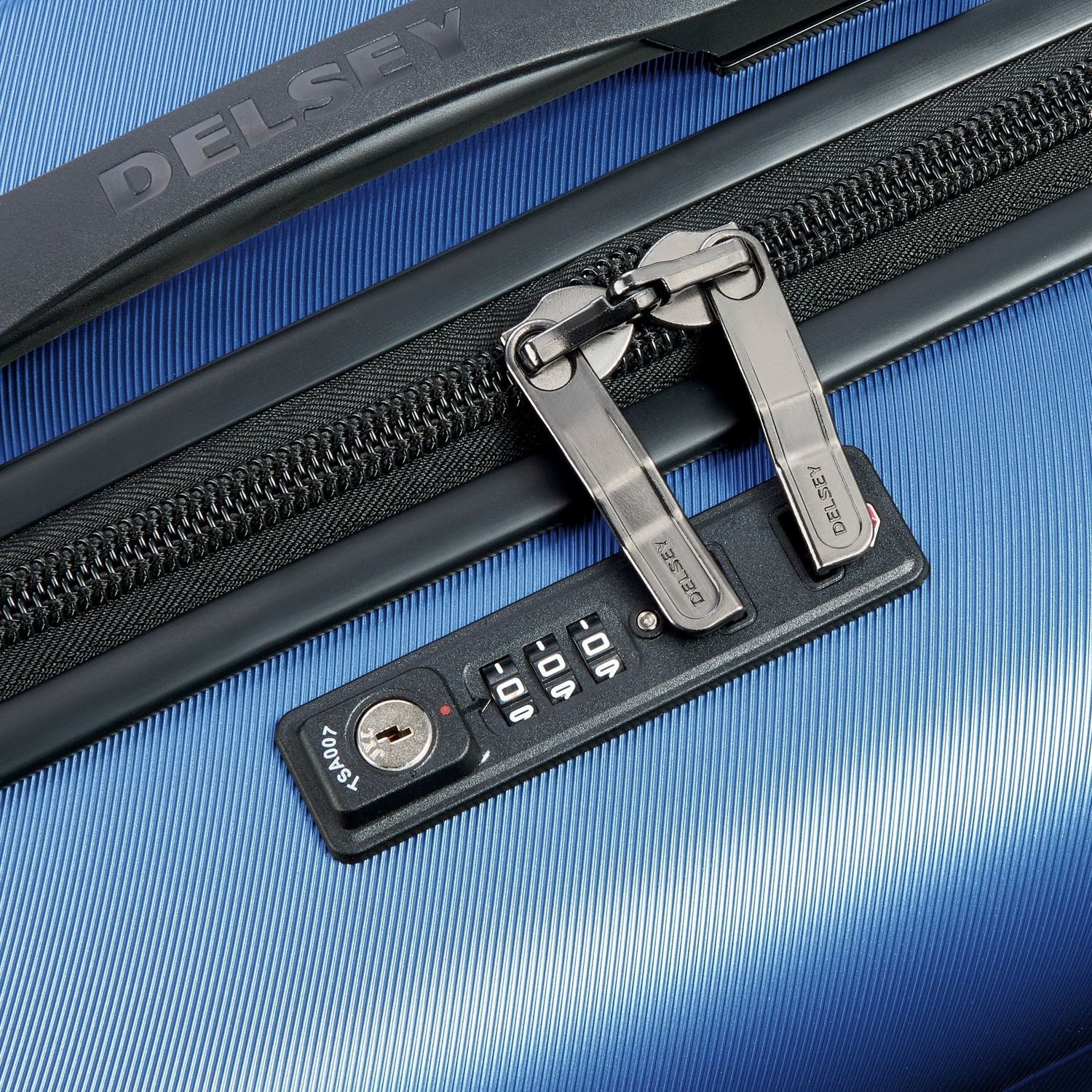 Blue Delsey luggage with TSA lock and zipper detail for secure travel
