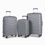 Grey hardshell luggage set with chevron design, spinner wheels, and extendable handles for travel