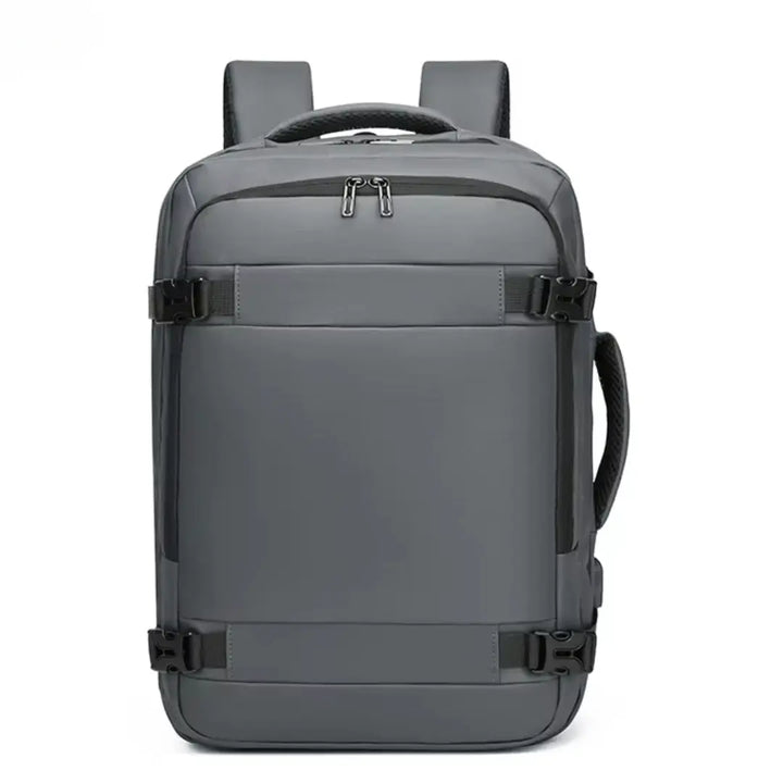 Grey travel backpack with side straps and top handle for laptop and student use