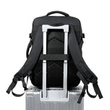 Black travel backpack with padded straps and luggage sleeve, ideal for students and laptop carry