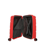 Red hardshell travel suitcase with spinner wheels and interior mesh pockets open for packing