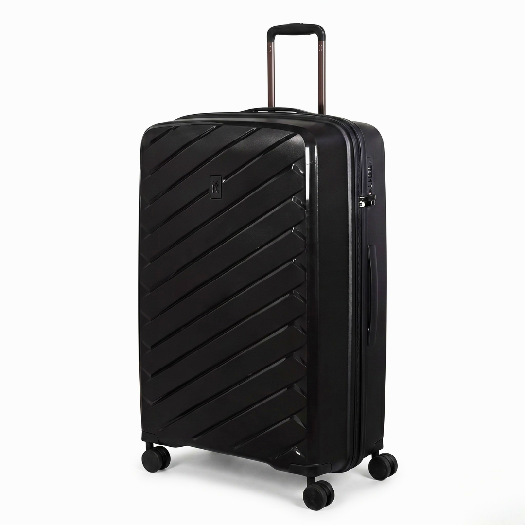 Black hardshell travel suitcase with diagonal ribbed design, spinner wheels, and telescopic handle